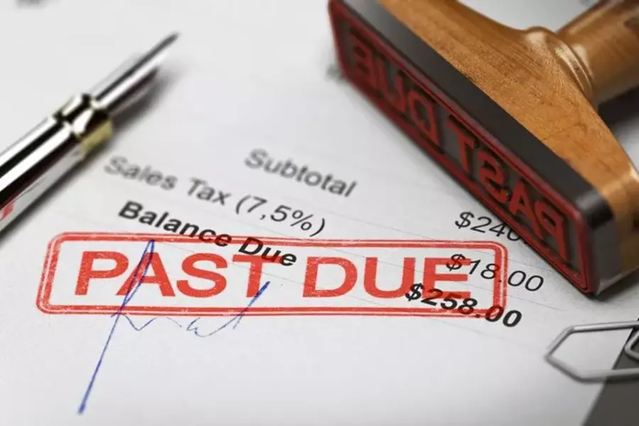 A bill with "Past Due" stamped in red ink