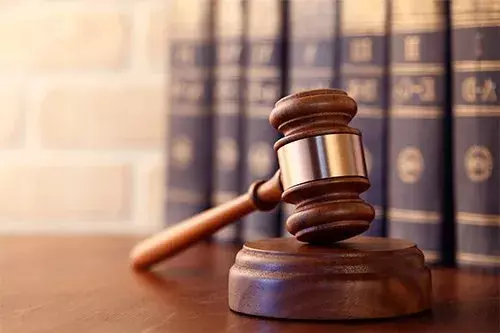 A bankruptcy law firm in Columbus, GA, showcasing a modern office environment with legal books and a conference table.
