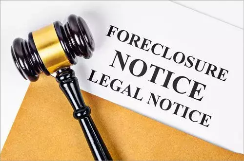 A legal foreclosure notice displayed prominently, indicating an impending foreclosure of the home.