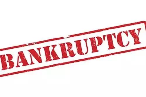A red stamp featuring the term "bankruptcy," representing a legal status of financial inability to meet obligations.