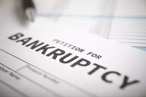 An illustration depicting the steps involved in filing for bankruptcy in Columbus, GA, showcasing relevant legal forms and procedures.